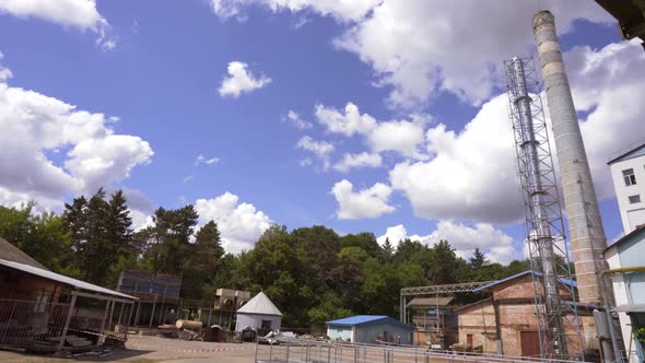 Demolition of old industrial brick pipe at the factory alt