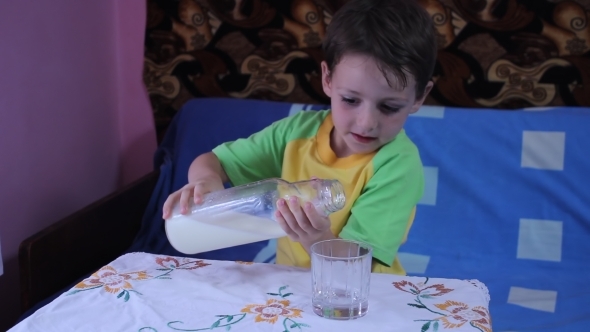 Little Boy Drinking Milk from his Cup 01