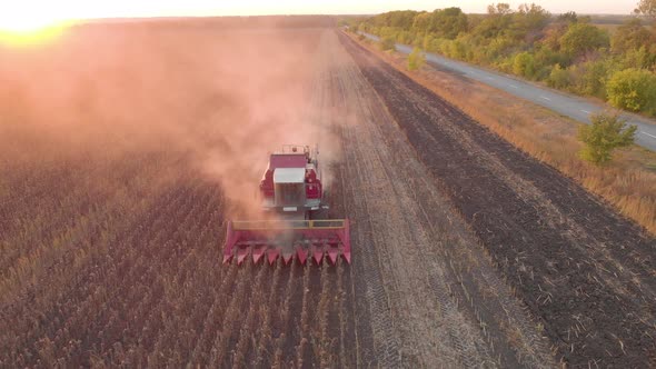 Aerial View Combine Harvesting on Sunflower Field. Mechanized Harvesting Sunflower. Large Field  alt