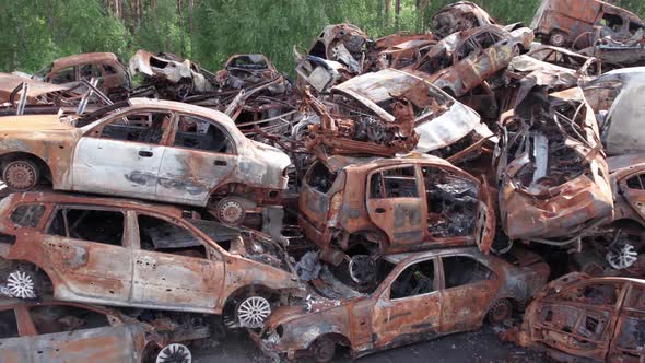 War in Ukraine a Dump of Shot and Burned Cars in Irpin Bucha District alt
