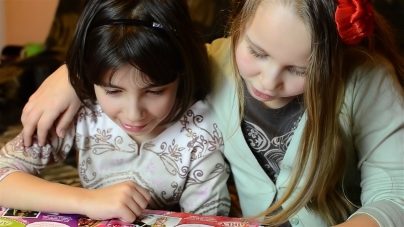 Two Girlsfriends Reading a Magazine 01