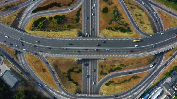 Aerial View of Highway and Overpass in City on a Cloudy Day alt