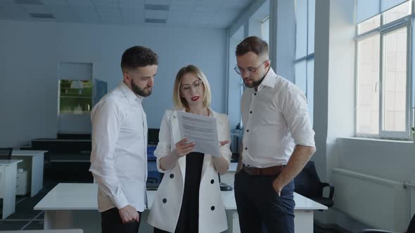 Lady Shows on Paper Documents Their Work alt