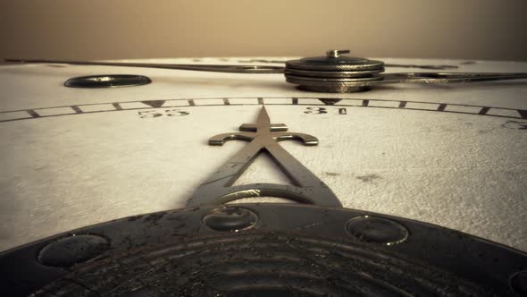 Retro antique clock. The decorative hands of the clock are moving on the dial. alt