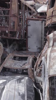 Vertical Video of a Dump of Destroyed Cars During the War in Ukraine alt