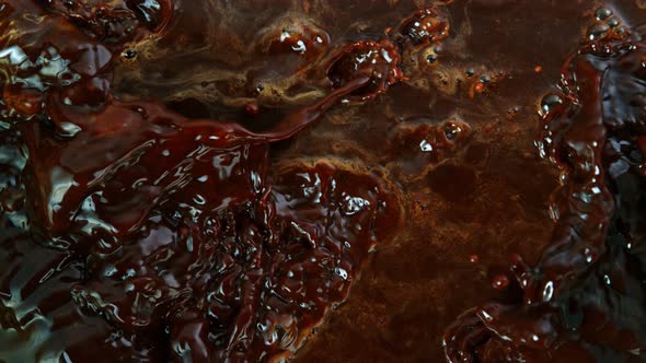 Super Slow Motion Shot of Splashing Coffee From Top Shot at 1000 Fps. alt