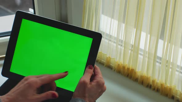 Adult Woman Working on Modern Tablet with Green Screen Mockup