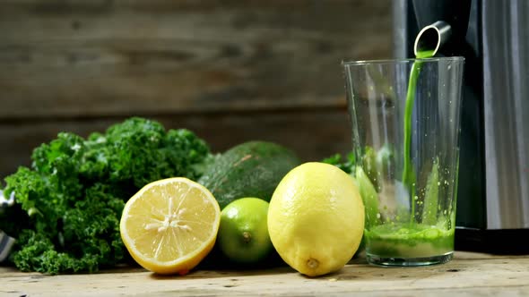 Juice being grind in juicer 4k alt