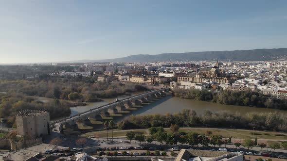 Aerial view across river with Roman bridge and Mosque-Cathedral of Cordoba