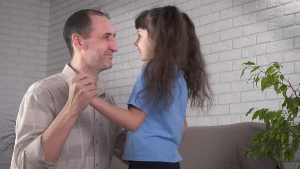 Family dancing in the room.  alt