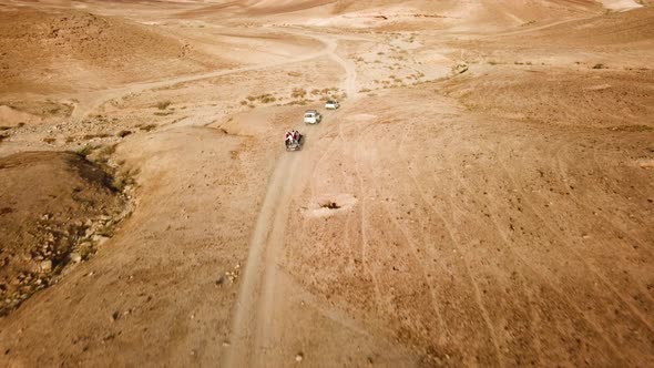 A group of travelers going through the Desert alt