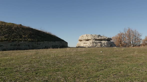 GAMZIGRAD, SERBIA - DECEMBER 25, 2017 Slow tilt on burial tumuli of Romula and her son near Felix Ro alt