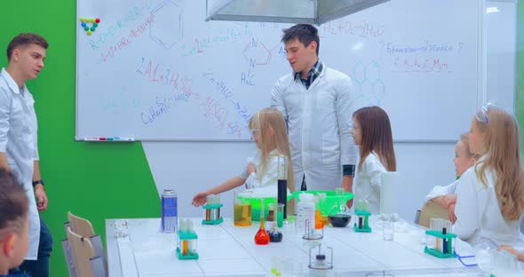 Teacher Showing Experiment How Fire Burning on Their Hands