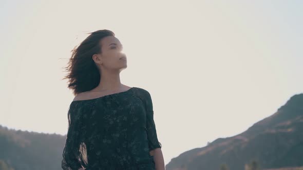 Attractive Lady in Elegant Clothes Poses in Pictorial Valley alt