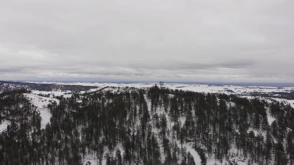 Wilderness Firetower on top of a mountain in the snow alt