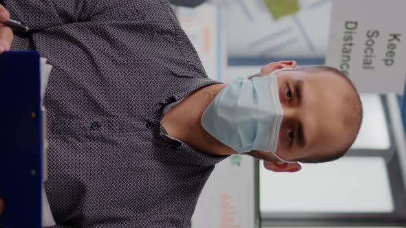 Vertical Video Pov Entrepreneur Man with Protective Face Mask During Zoom Meeting Call alt