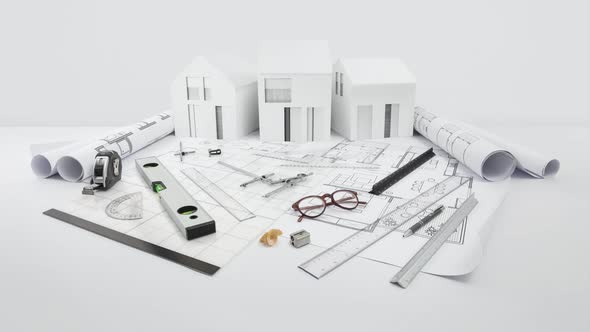 architectural model of houses on blueprint with measurement and drawing technical tools, desk for bu