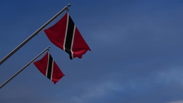 Trinidad And Tobago Flags In The Blue Sky - 4K