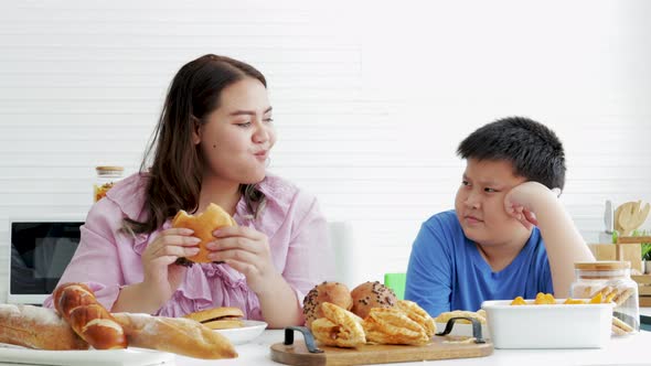 Fat Son forbids Fat Mom from eating bread and bakery. junk food, unhealthy