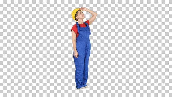 Engineer construction worker woman looking up at a building alt