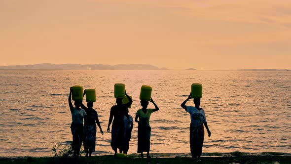 Filling and Transportation of Water Bottles at Lake alt
