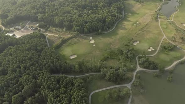 Aerial View of Large Luxury Golf Course. View of the Green Lawns and Trees. Shooting From Above, Top alt