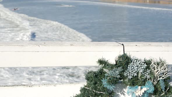 Christmas Wreath on Pier New Year on Ocean Coast California Beach at Xmas alt