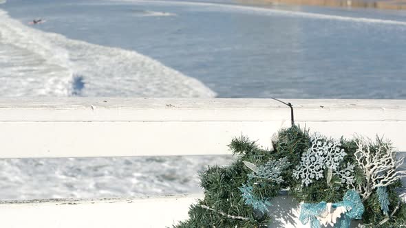Christmas Wreath on Pier New Year on Ocean Coast California Beach at Xmas