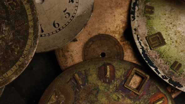 Rotating stock footage shot of antique and weathered watch faces - WATCH FACES 015 alt