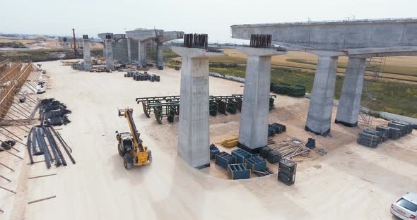 Aerial footage of a large scale highway construction project alt