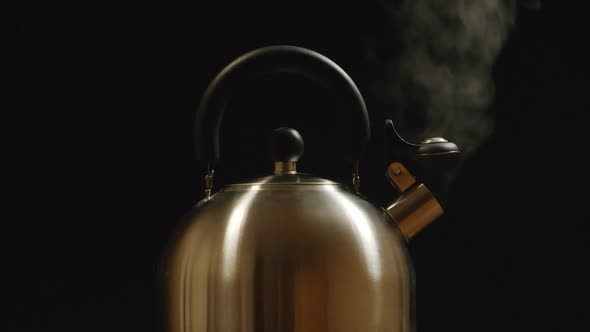 Steam From A Steel Kettle. Black Background