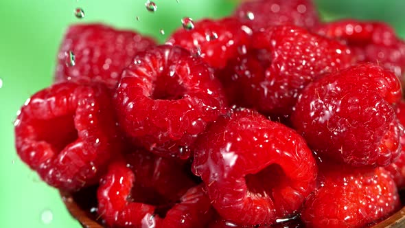 Super Slow Motion Shot of Splashing Water on Fresh Raspberries at 1000Fps alt