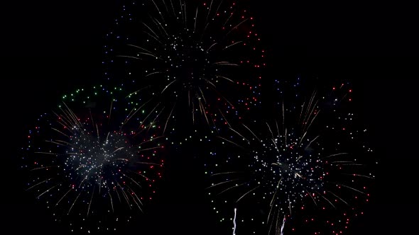 Many flashing colourful fireworks in event amazing with black background.