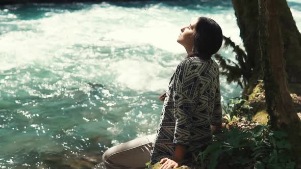 the Woman Crouched Beside the Lonely Tree and the Fast Flow of the River To Rest alt