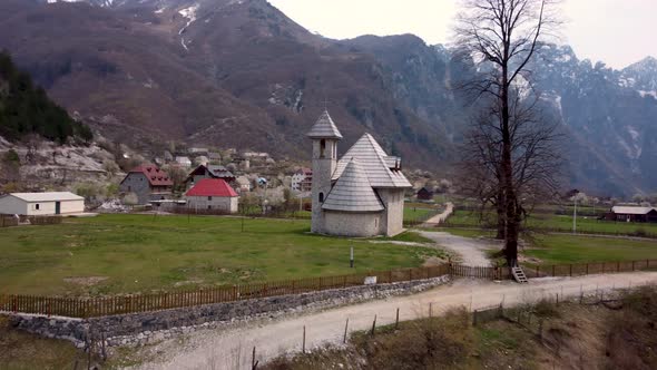 Dronehsot of a Church in the Alps alt