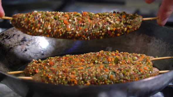 Lula Kebab Frying in a Pan.