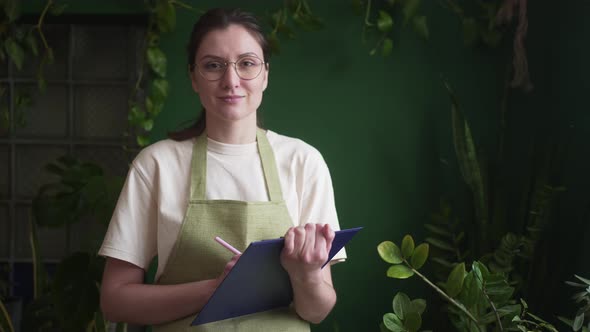 Portrait of a Florist is a Small Business Owner with a Tablet in Hands