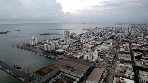 drone shot of the shipyards of the port of veracruz at dawn alt