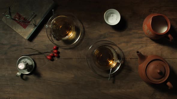 Top view over two glass cups of steaming tea