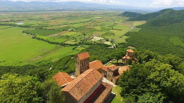 Breathtaking aerial shot of ancient Nekresi monastery complex and valley alt