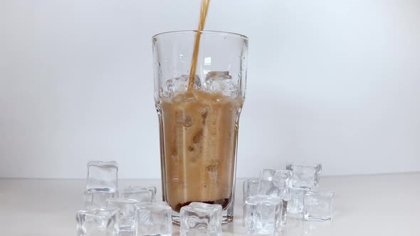 A refreshing drink of stake is poured into a glass beaker with a tube.