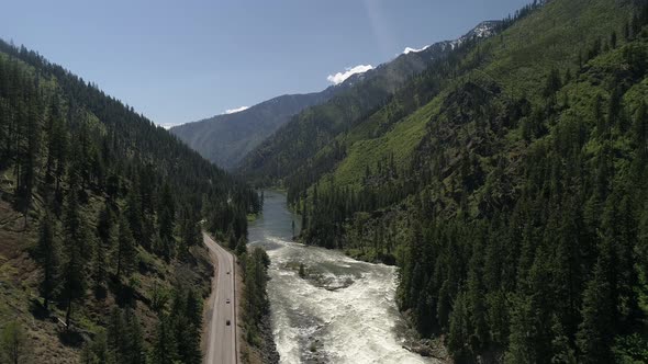 Aerial Of Vibrant Green Mountain Landscape With Highway 2 By Wenatche River alt