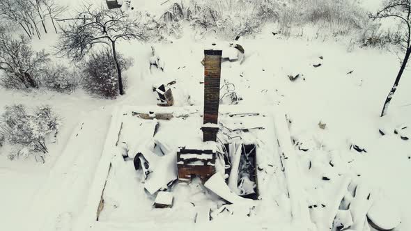 Tragic Winter Village Landscape with a Stove and a Burnt House Aerial View alt