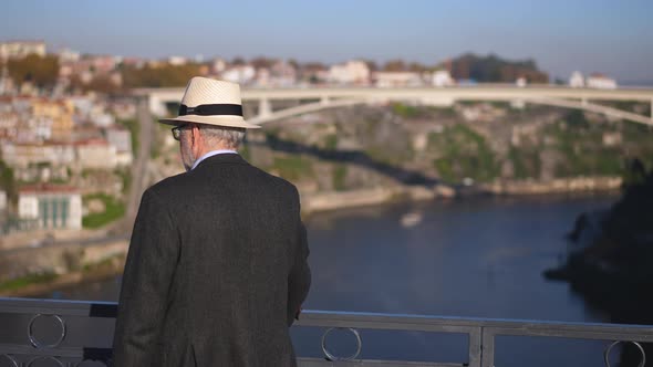 Old Gray Haired Traveler Man in White Fedora Hat Walk on Ponte De Dom Luis I