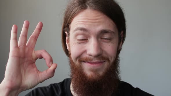 Portrait of Bearded Man Showing Ok Sign