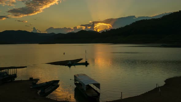 Boat on Lake With Sunset alt