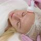 Attractive Woman In A Cosmetology Clinic Receives A Phonophoresis Procedure For The Skin  - VideoHive Item for Sale