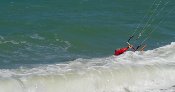 Active People Practicing Human Kitesurfing and Windsurfing alt