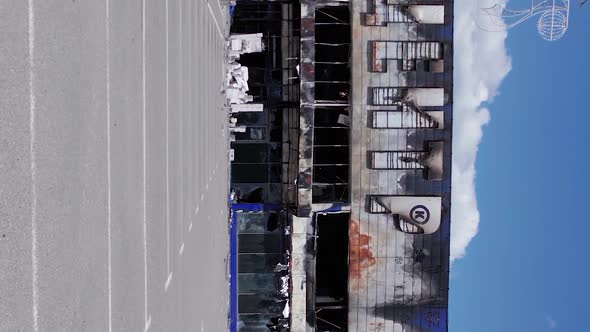 Vertical Video of the War in Ukraine  Destroyed Shop Building in Bucha alt