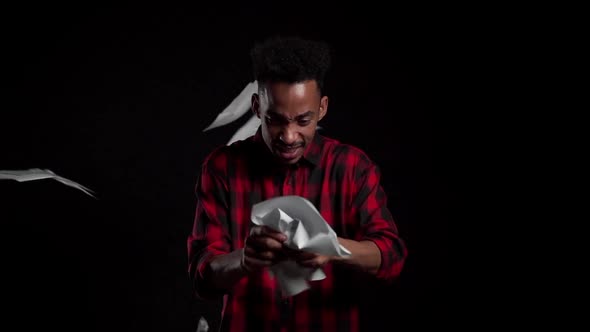 Serious african businessman boss on black background. He is unsatisfied, anxious alt